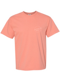 Front of Terracotta Tee with small white Humpback Whale outline on chest.